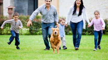 Family running with dog